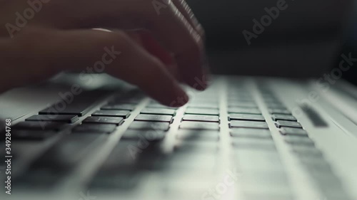 4k female office worker hands typing on laptop keyboard , Hands touch typing pointing cloud data social network media, working from home during quarantine, Extreme close-up human hands on keyboard 4k photo