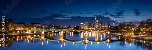 Illuminated Cityscape of Frankfurt am Main  Germany at Night with Reflective Bridge