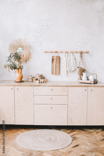 Cozy wooden kitchen in rustic style. Stylish kitchen interior. Kitchen accessories. Cooking concept