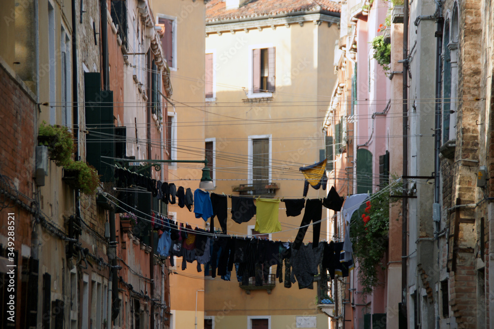 Photo of the street in Venice with loundry on the rope. Castello district.