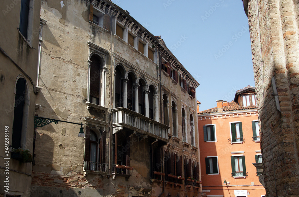 Photo of the street in Venice with historical facades.