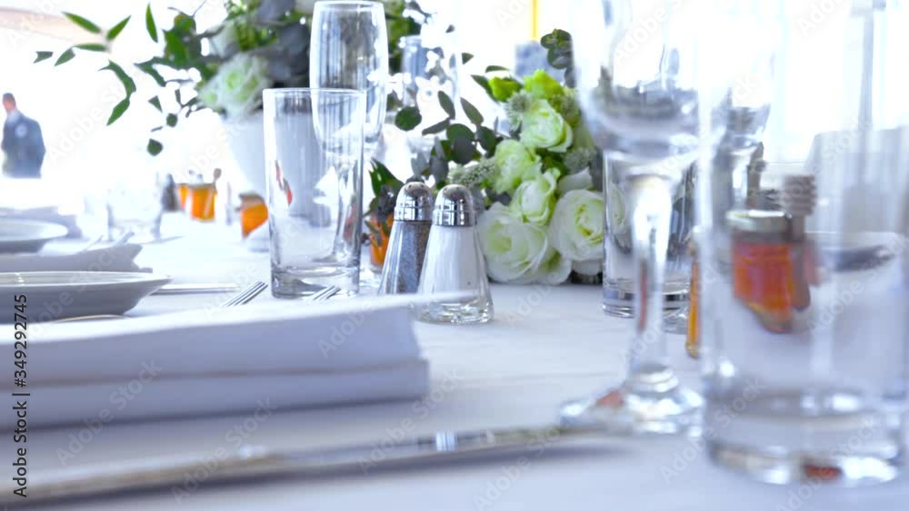 Camera Sweep across dinner table design with orange honey jar and flowers