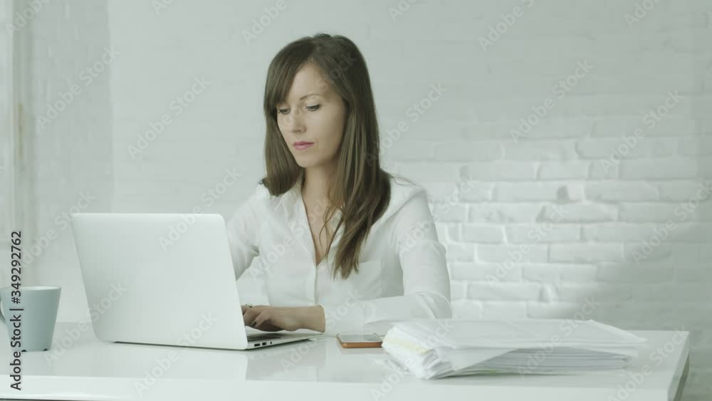 Business woman working with computer in office or from home office. White background with copy space. Business woman working with computer in office or from home office. White background with copy space.