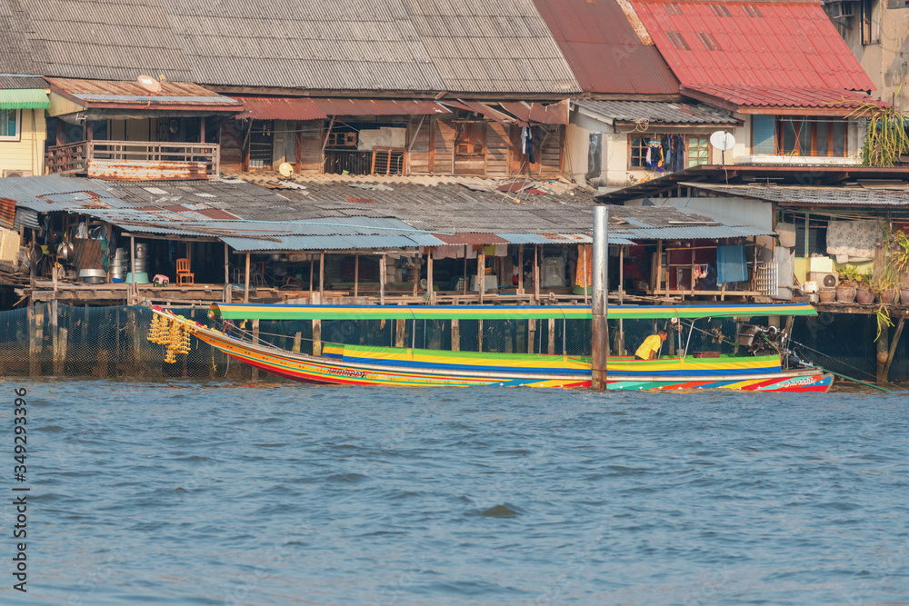 .03/02/2020 Bangkok, Thailand. The long tail boat in Chao Phraya river carries passengers between the banks of the river. Long tail boat is a very popular and affordable transport among locals. .03/02/2020 Bangkok, Thailand. The long tail boat in Chao Phraya river carries passengers between the banks of the river. Long tail boat is a very popular and affordable transport among locals.