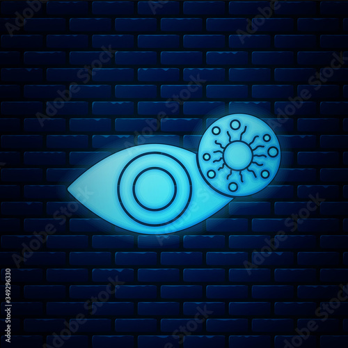 Glowing neon Reddish eye due to virus, bacterial or allergic conjunctivitis icon isolated on brick wall background. Vector Illustration