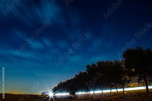Night sky with a light trail photo