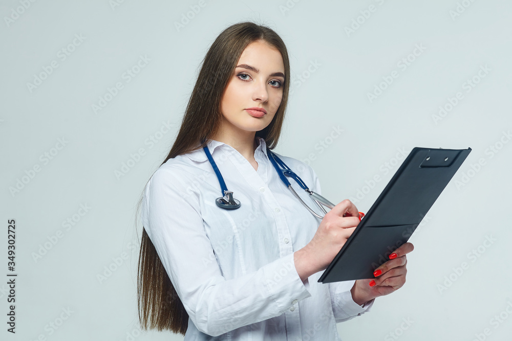 portrait of a doctor with clipboard and stethoscope isolated on a white background portrait of a doctor with clipboard and stethoscope isolated on a white background