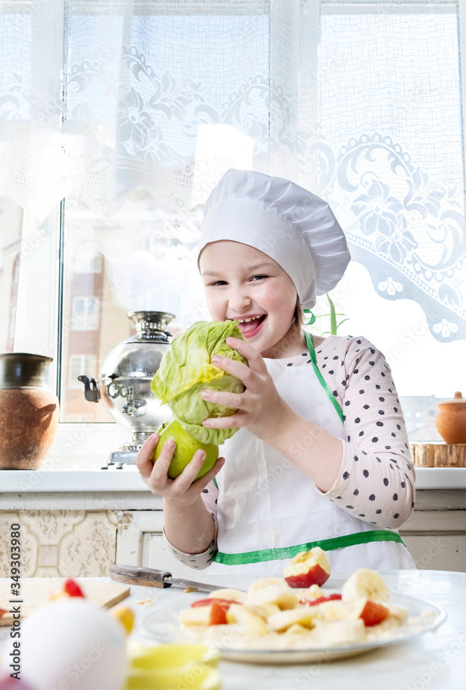 A child in the kitchen playing cook A child in the kitchen playing cook