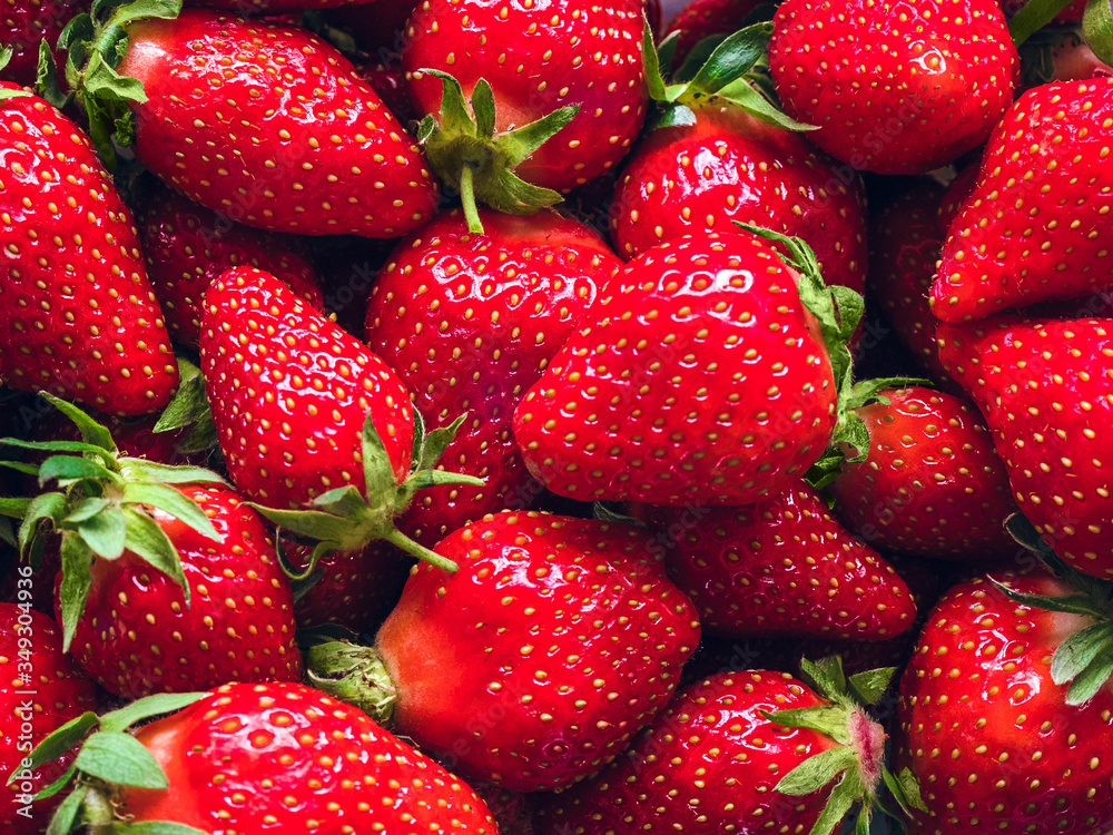 a lot of ripe juicy strawberries - background