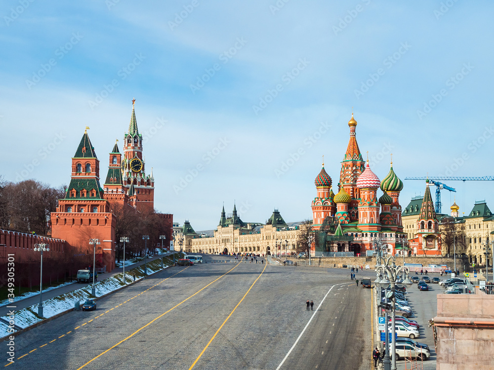 View of the walls and towers of the Moscow Kremlin, St. Basil's Cathedral on Red Square from the Bolshoi Moskvoretsky Bridge in early spring