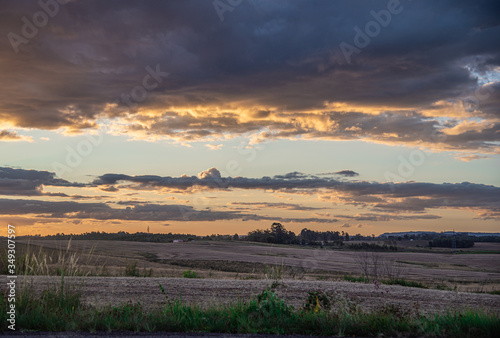 Dusk with sun and clouds on an agricultural production farm in the south of Brazil
