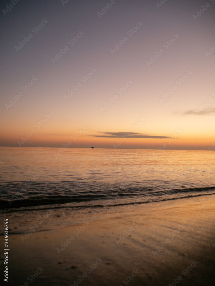 Sunset on small waves seaside beach Sunset on small waves seaside beach
