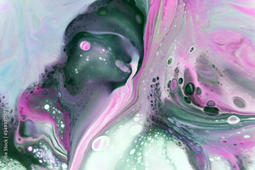 Fototapeta premium Abstract background of mixed colors. Flowing paint on the surface. Colorful wallpaper for design