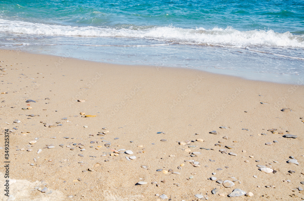 Seascape background white sea waves on golden sandy beach