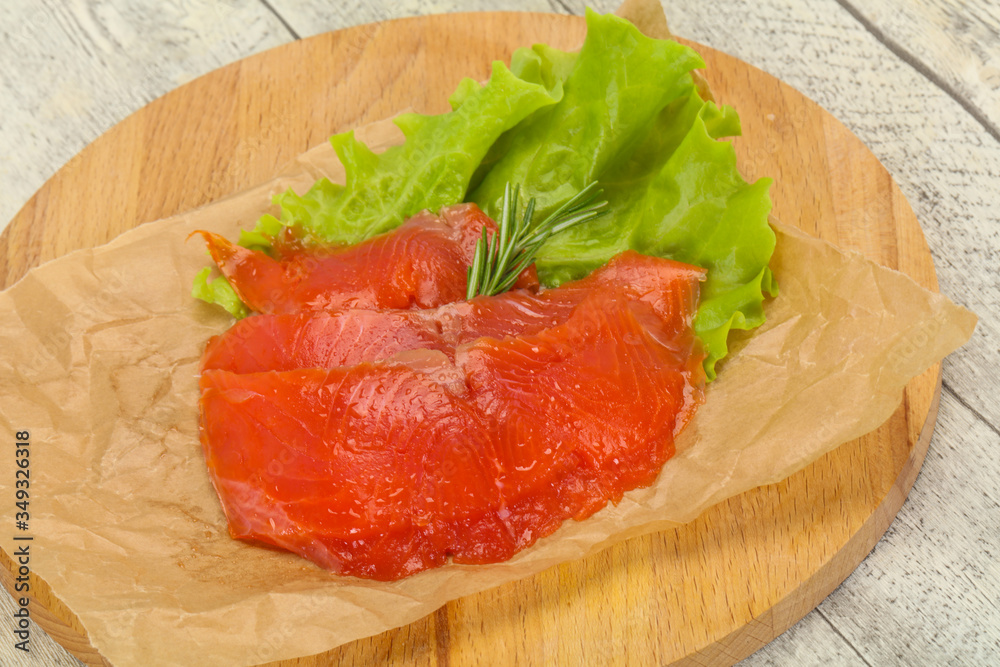 Sliced salmon fillet served rosemary Sliced salmon fillet served rosemary