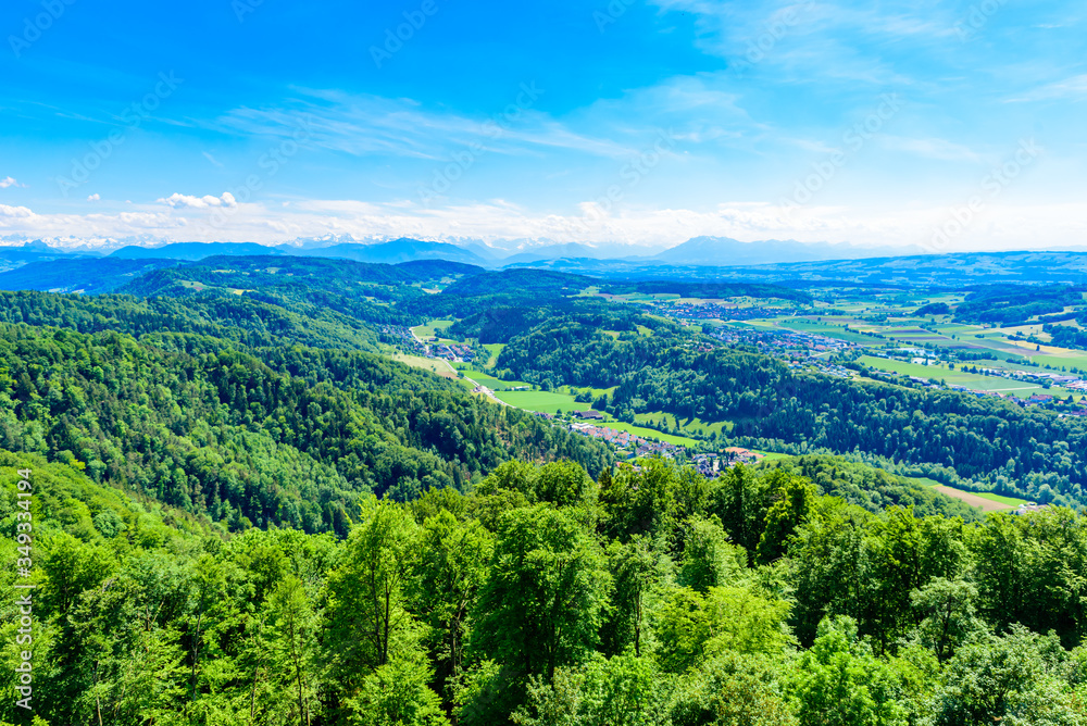 Obraz premium Panoramic view of Zurich lake and Alps from the top of Uetliberg mountain, from the observation platform on tower on Mt. Uetliberg, Switzerland, Europe