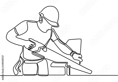 One continuous line drawing of young handsome handyman cut wooden board. Professional carpenter cut wooden boards. Building construction service concept one line draw design illustration