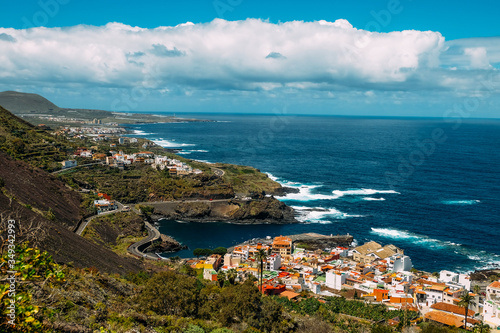 Panorama of the city of Garachico from above on the background of the ocean. The island of Tenerife in the spring on a Sunny day. A town on a tropical island in Spain