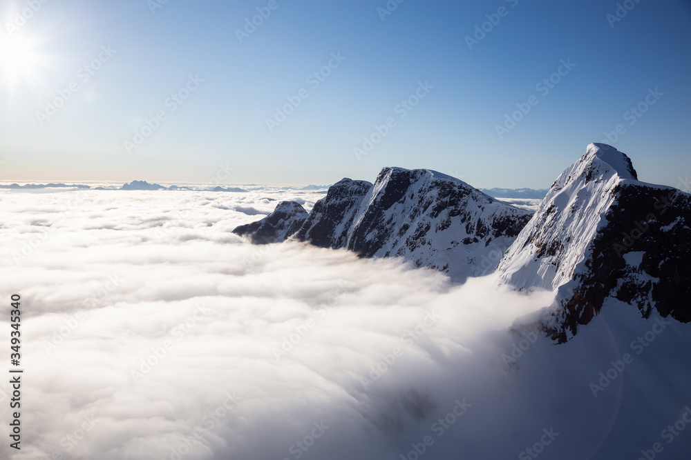 Aerial View of Remote Canadian Mountain Landscape during sunny sunrise. Located near Vancouver, British Columbia, Canada. Nature Background. Authentic