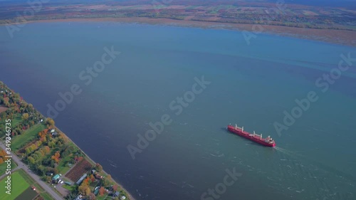 Freighter Moving up the St Lawerence River near Quebec City Canada photo