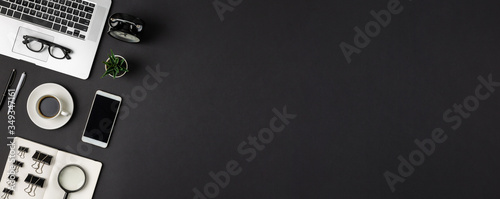 Abstract dark minimal workplace flat lay