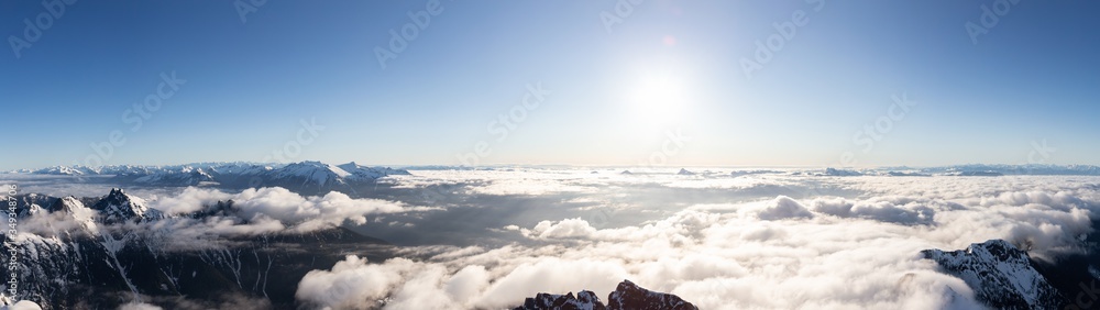 Obraz premium Aerial Panoramic View of Remote Canadian Mountain Landscape during sunny morning. Located near Vancouver, British Columbia, Canada. Nature Panorama Background. Authentic