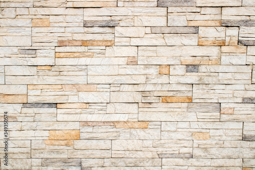 Texture and background of light colored stonewall