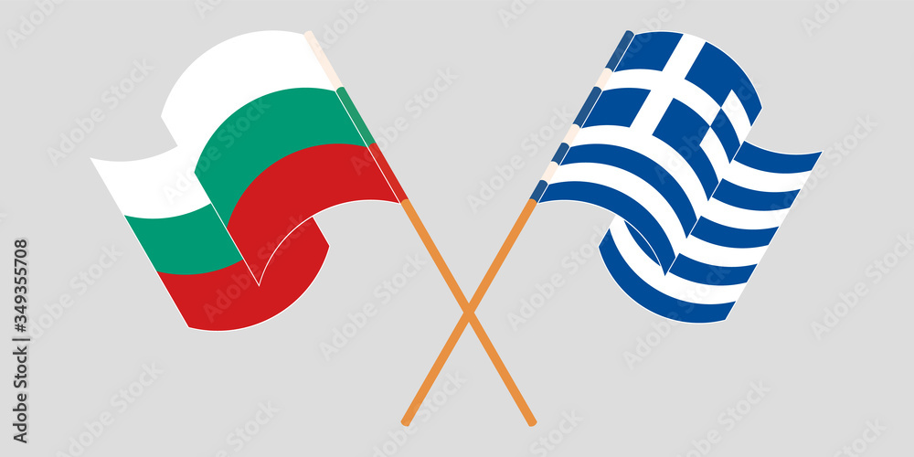 Crossed and waving flags of Bulgaria and Greece