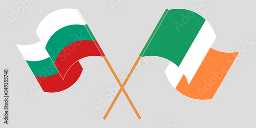 Crossed and waving flags of Bulgaria and Ireland