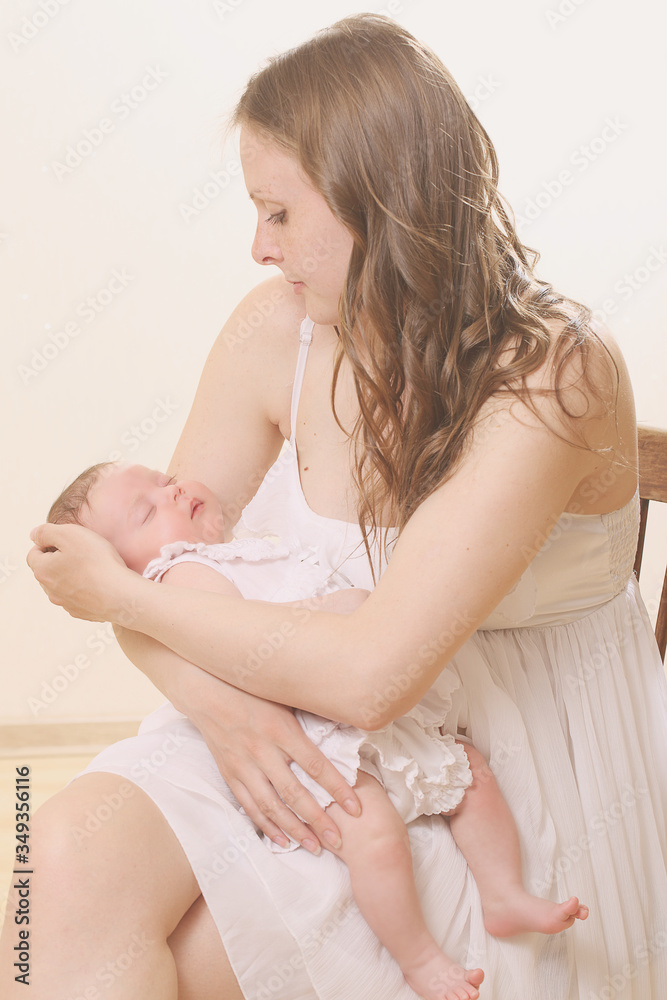 Beautiful young mother holds a baby Beautiful young mother holds a baby