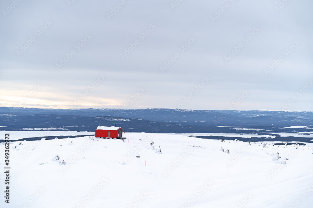 red house on top of a mountain in the Arctic circle red house on top of a mountain in the Arctic circle
