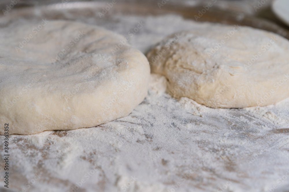 Cooked dough lies on flour for further baking