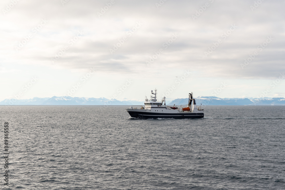 Fishing boat in Arctic sea near Longyearbyen, Svalbard archipelago Fishing boat in Arctic sea near Longyearbyen, Svalbard archipelago
