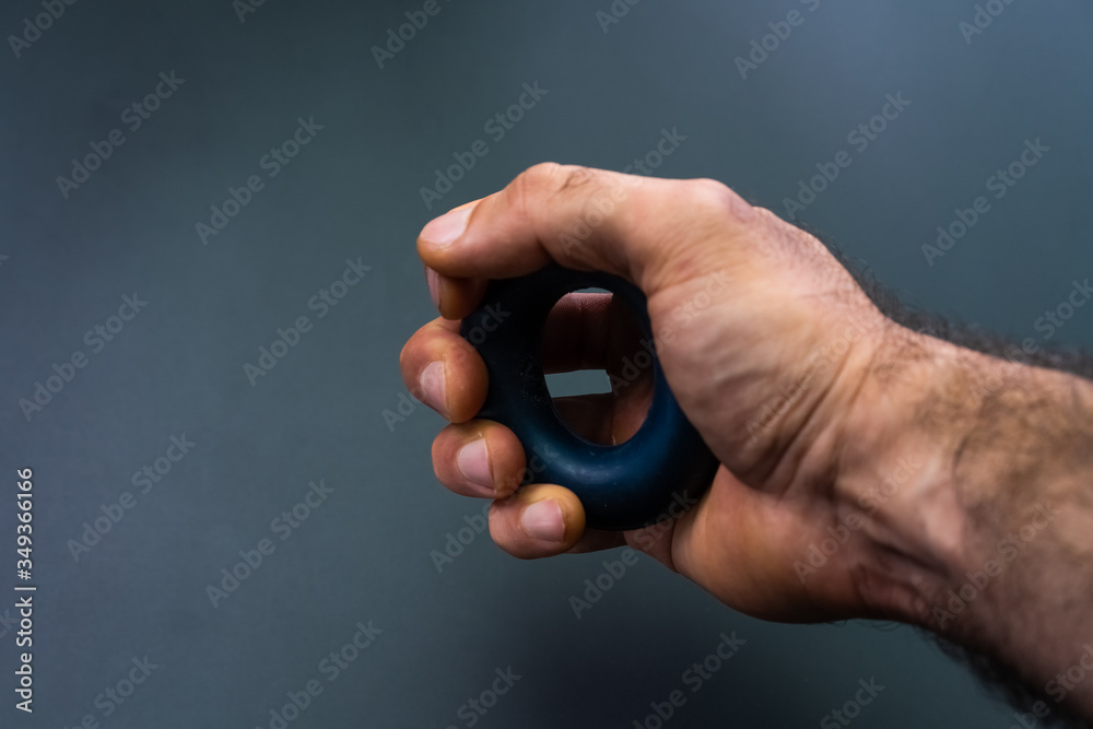 Exercise hand exercises on a black background Exercise hand exercises on a black background