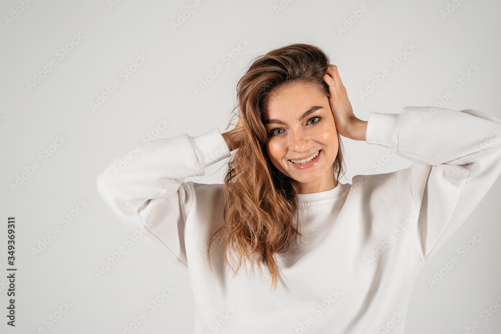 Thoughtful person concept. Close up photo portrait of a lovely cheerful woman, holding hands near face. Isolated on white background Thoughtful person concept. Close up photo portrait of a lovely cheerful woman, holding hands near face. Isolated on white background