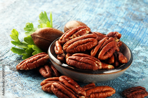 Tasty Pecan nuts on a rustic table.