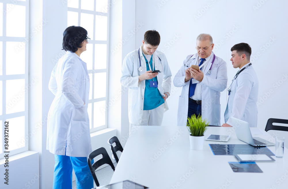 Successful medical team. Confident doctors team standing together and smiling Successful medical team. Confident doctors team standing together and smiling