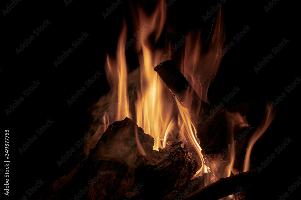 A fire on logs on a dark night A fire on logs on a dark night