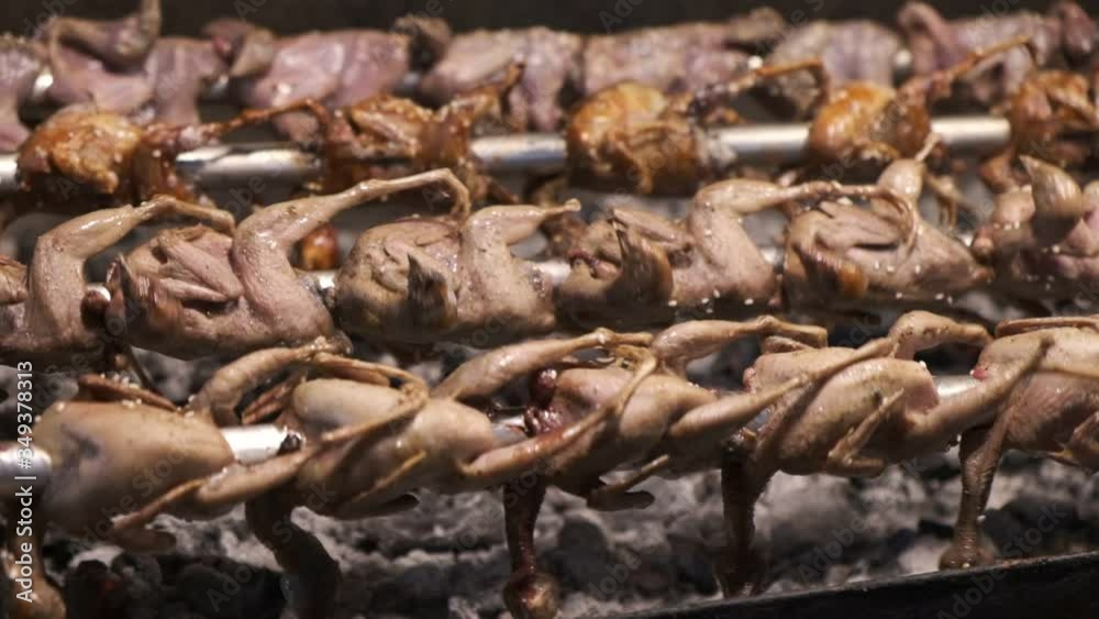 Grilling chicken on a thai night market in Surat Thani slow motion Grilling chicken on a thai night market in Surat Thani slow motion