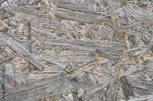 plywood gray color. background texture of aged sheet of plywood with fragments of compressed sawdust