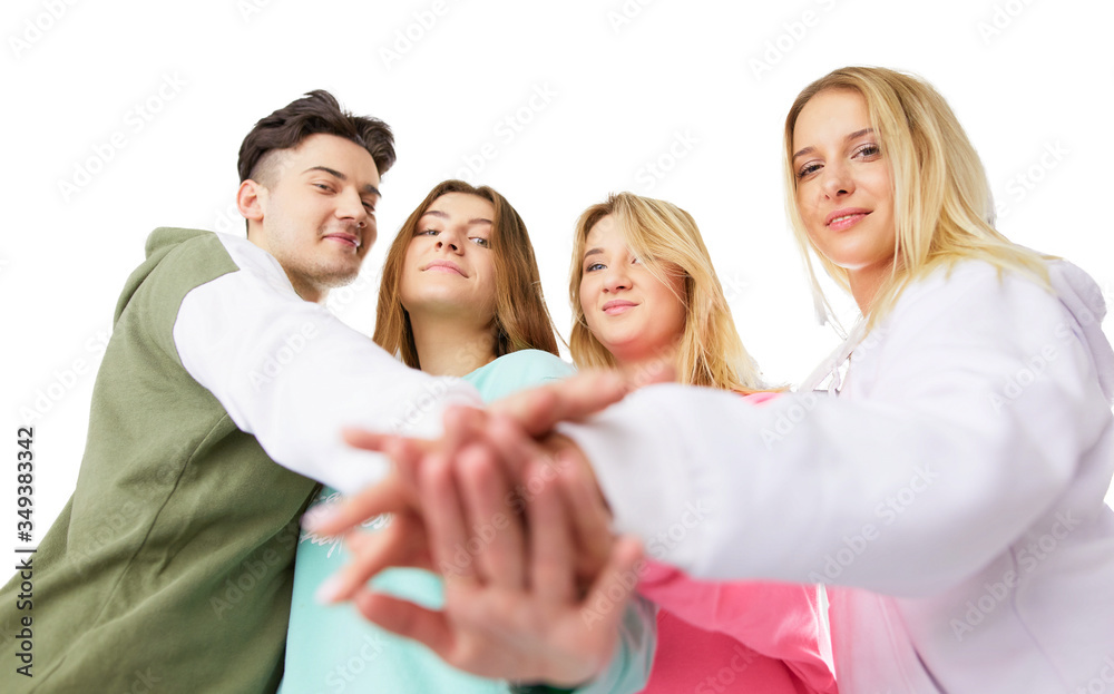 Group of teens stacking their hands, unity and solidarity Group of teens stacking their hands, unity and solidarity