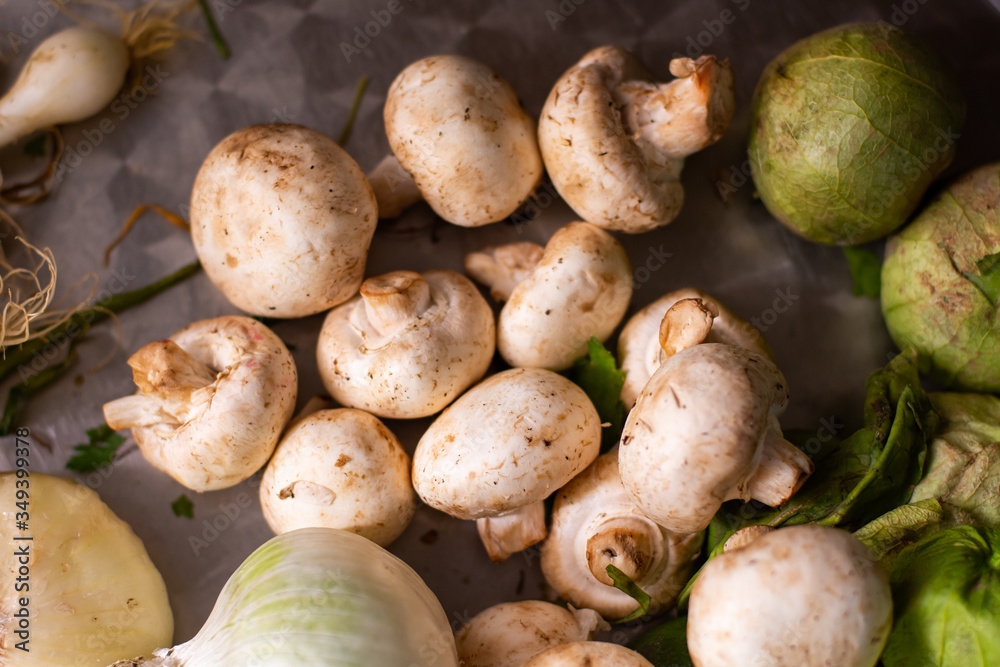 From above some mushrooms and vegetables on a table From above some mushrooms and vegetables on a table