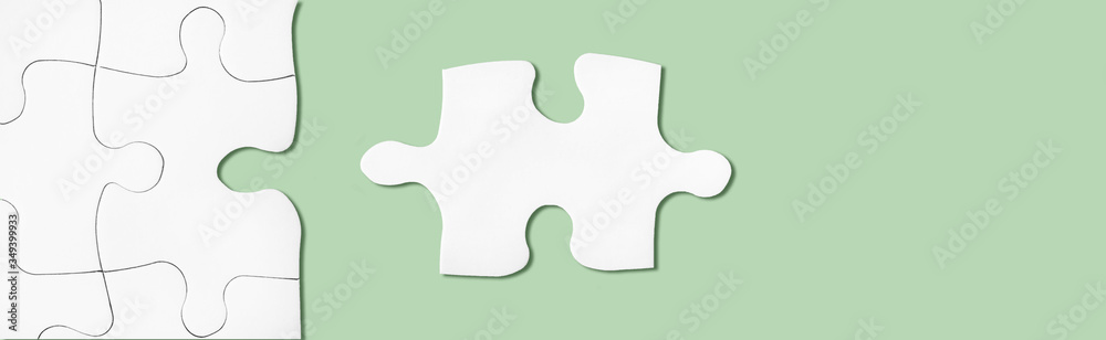 Puzzle on green surface. Connecting, network, synergy idea. Metaphor of teamwork, hr, problem solving. Puzzle on green surface. Connecting, network, synergy idea. Metaphor of teamwork, hr, problem solving.