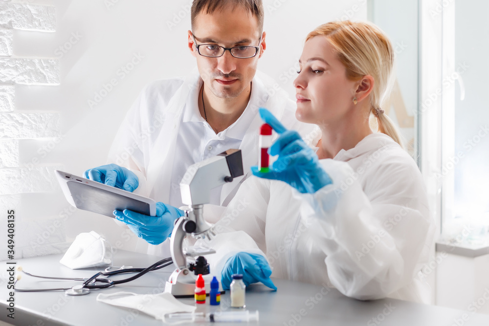 Fototapeta premium Flu virus experiment - scientist in laboratory with microscope, wear protective eyewear