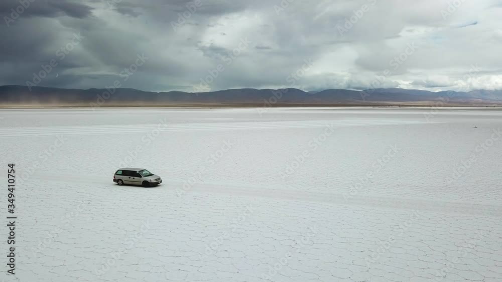 Solitary 4x4 Van Vehicle in Massive White Salt Flat Under Dramatic Sky. Salinas Grandes, Salta, Argentina Solitary 4x4 Van Vehicle in Massive White Salt Flat Under Dramatic Sky. Salinas Grandes, Salta, Argentina