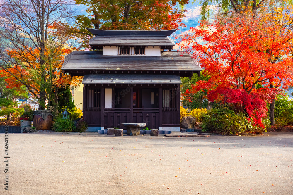 Japan. Kawaguchiko. Island of Honshu. Japanese building on the background of autumn trees. Japan in the fall. Landscapes Of East Asia. Architecture Of Japan. Kawaguchiko nature reserve. Travel to Asia