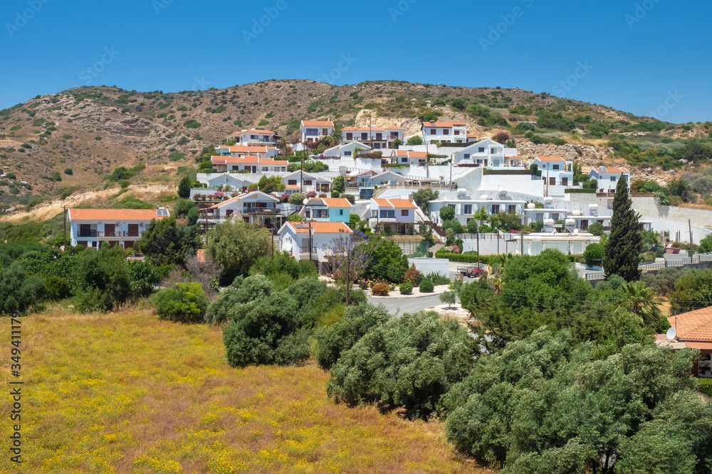 Cyprus. The village of Pissouri on the background of the hill. Resort place in Cyprus. Village of white houses in Cyprus. Vacation in the Mediterranean. Seaside resort.