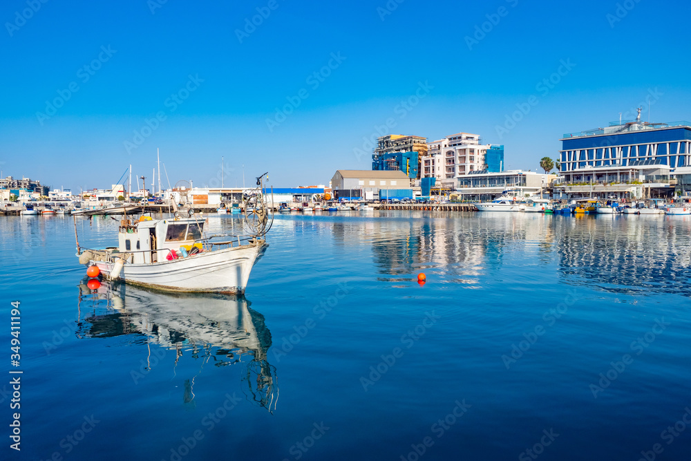 Cyprus beach. Limassol. The Harbour Of Portobello. Boat in the Harbor in Cyprus. Water trips on the Mediterranean sea. Holidays in Cyprus.