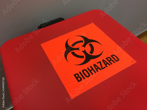 biohazard red label container for needles and syringes