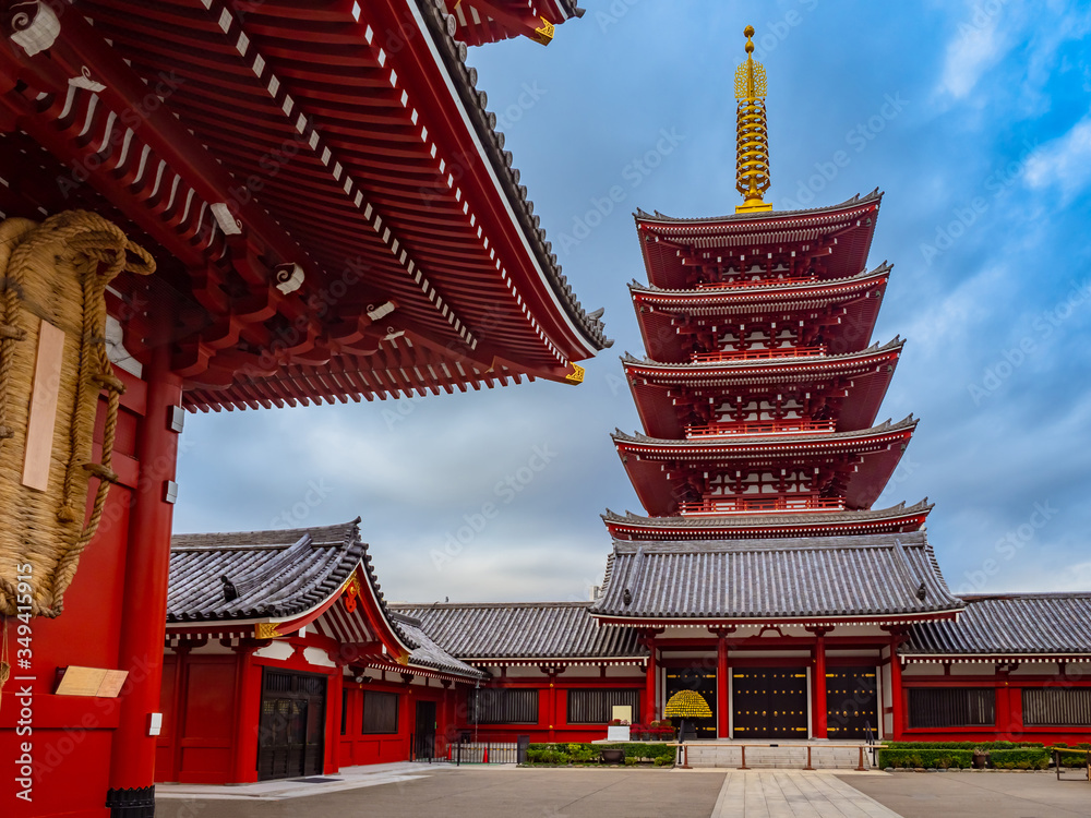 Japan. Asakusa Temple in Tokyo. Japanese pagoda on the background of blue sky. Sights of Tokyo. Sensoji Temple in sunny weather. Buddhist temple in Japan. Red Pagoda. Japan traditional. Japan. Asakusa Temple in Tokyo. Japanese pagoda on the background of blue sky. Sights of Tokyo. Sensoji Temple in sunny weather. Buddhist temple in Japan. Red Pagoda. Japan traditional.